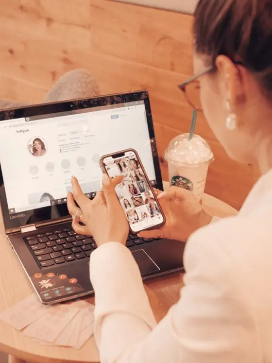 Business owner scrolling social media without a marketing strategy